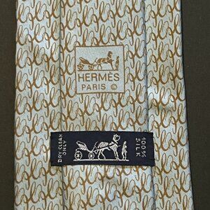 Hermès Silk Tie with Cursive H Logo Links Pattern in Light Blue and Brown